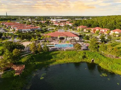 an aerial view of a resort with a lake at 4BR Townhome with Lake View – BL481 in Kissimmee