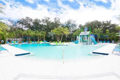 a large swimming pool with a water slide at Ground floor spacious house 4BR VP2512 in Kissimmee