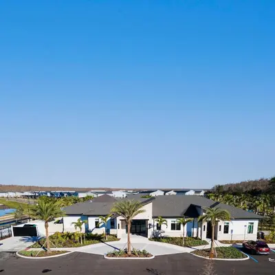 arial view of a building with palm trees at 4 BR Bright Cozy at Storey Lake SL3113 in Kissimmee