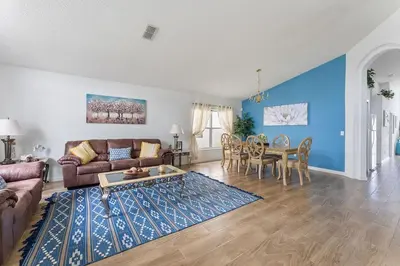 a living room with a couch and a table at 4 BR No carpet Just Remodeled Unit SR1205 in Kissimmee
