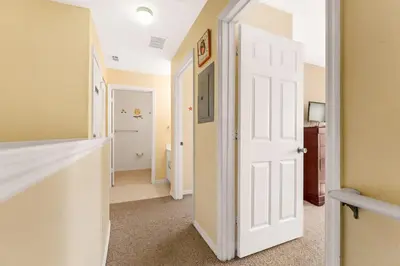 a hallway with a white door in a room at Relaxing 3BR Haven for 8 at Seven Dwarfs SD2610 in Kissimmee