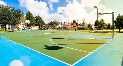 a tennis court with a basketball hoop at Relaxing 3BR Haven for 8 at Seven Dwarfs SD2610 in Kissimmee
