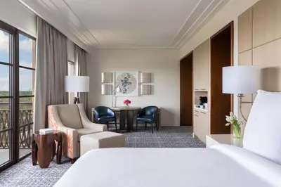 a hotel room with a bed and a desk at Four Seasons Resort Orlando at Walt Disney World Resort in Orlando