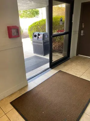 an entrance to a door with a mat in front of it at Studio near Universal Studios with great view in Orlando