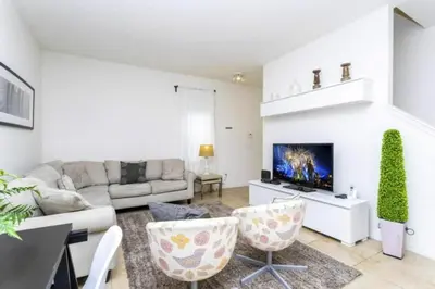a living room with a couch and a tv at 4572 Perfect home for your family close to all parks in Kissimmee