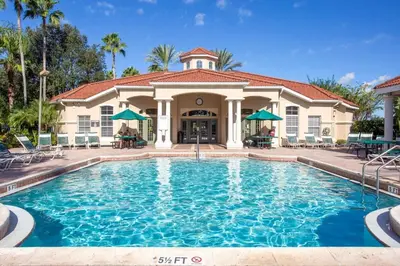 a large swimming pool in front of a house at 8553 Stunning house close to Animal Kingdom in Kissimmee