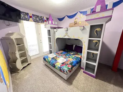 a bedroom with a bed and a princess room at Mickeys Escape - Magical Lakeview 7BR - 4 Master Suites Pool & Hot Tub BBQ Home Theater and 2 Miles Disney! in Orlando