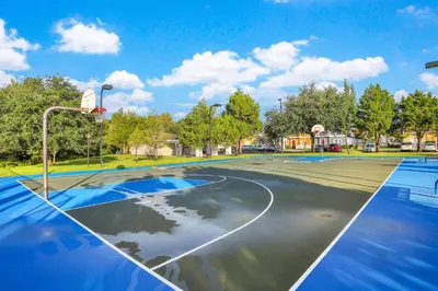 an empty basketball court with a basketball hoop at Villas at Seven Dwarfs Resort - Near to Disney in Kissimmee