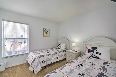 a bedroom with two beds and a window at Pool and Lanai Emerald Isle Resort Home! in Kissimmee