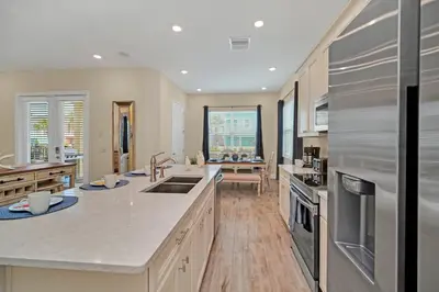 a large kitchen with white countertops and a large island at 2914 Salted Rim Road in Orlando