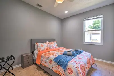 a bedroom with a bed and a window at Sunny Clermont Retreat with Lanai 12 Mi to Disney! in Orlando