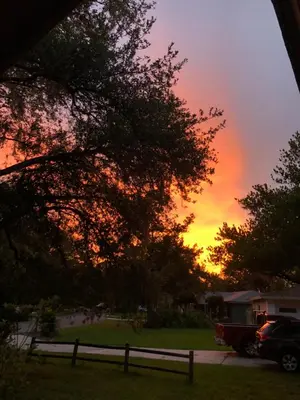 a fire truck parked in a yard with a sunset at Sanford Lake Mary Quiet Rooms in Sanford