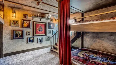 a room with two bunk beds and a staircase at Magical 7BR Resort Pool Home Near Disney & Orlando Attractions in Kissimmee