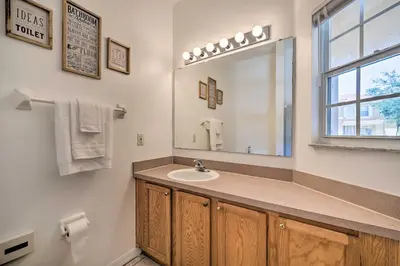 a bathroom with a sink and a mirror at 9 Mi to Disney Resort Getaway with Private Patio! in Kissimmee