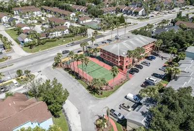 an aerial view of a building with a tennis court at Poinciana Paradise in Kissimmee