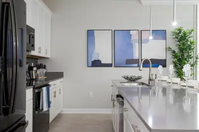 a white kitchen with a sink and a refrigerator at Gorgeous 4Bd w/ Pool Close to Disney @ Storey Lake 4289 in Kissimmee