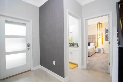 a room with a door and a bedroom with a bed at Gorgeous 4Bd w/ Pool Close to Disney @ Storey Lake 4289 in Kissimmee