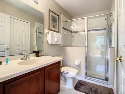 a bathroom with a toilet and a sink and a shower at Fantastic 7 Bed 6 Bath in Prestigious Gated Comm, villa in Orlando