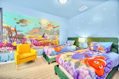 a bedroom with two beds and an aquarium mural at 3BR Condo with Pool - Near Disney in Orlando