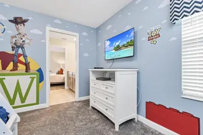 a childs room with a toy story bedroom at Delight Indoor Adventure Steps From Disney in Kissimmee