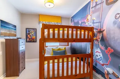 a childs bedroom with a bunk bed and a mural at 2788 Windsor Hills in Orlando