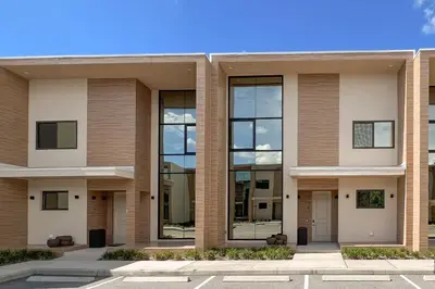 an image of a building with large windows at Cozy Home Resort Community Disney 5 Min in Orlando