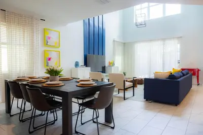 a dining room with a table and chairs at Private Vacation Home at Storey Lake, Orlando Florida in Kissimmee