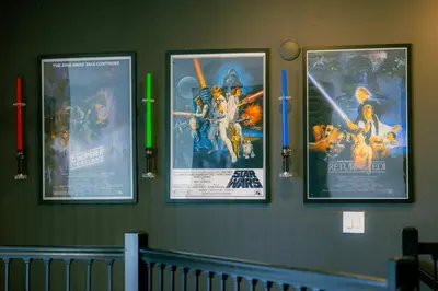 three movie posters hanging on a wall at Private Vacation Home at Storey Lake, Orlando Florida in Kissimmee