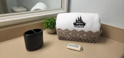 a bathroom counter with a towel on top of a sink at My Home in Orlando in Kissimmee