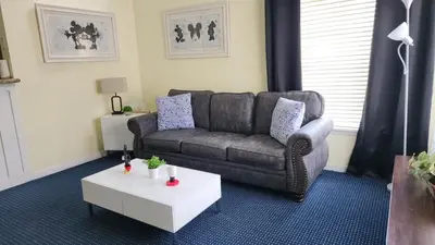 a living room with a couch and a coffee table at My Home in Orlando in Kissimmee
