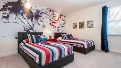two beds in a bedroom with a mural on the wall at Elegant Fun Vacation Home at Encore Resort 7529 in Orlando