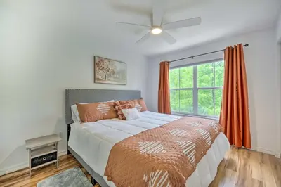 a bedroom with a large bed and a window at Kissimmee Condo Community Perks, 10 Mi to Disney! in Kissimmee