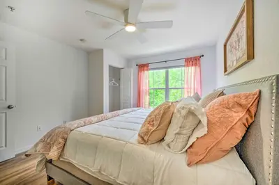 a bedroom with a bed with a ceiling fan at Kissimmee Condo Community Perks, 10 Mi to Disney! in Kissimmee