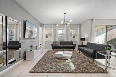 a living room with a couch and a table at 7 Bedrooms 65 Bathrooms Solara 9024 Fk in Orlando