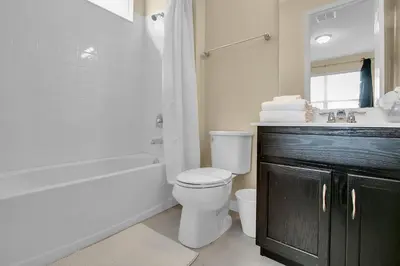 a bathroom with a toilet and a sink and a shower at 7 Bedrooms 65 Bathrooms Solara 9024 Fk in Orlando