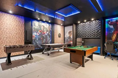 a gaming room with two pool tables and video games at 7 Bedrooms 65 Bathrooms Solara 9024 Fk in Orlando