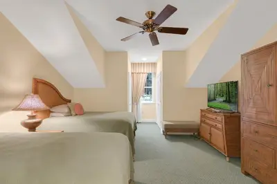 a bedroom with two beds and a ceiling fan at 3 Bedrooms 25 Bathrooms Reunion Resort 1589 Hc in Orlando