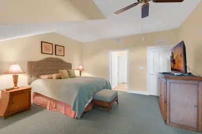 a bedroom with a bed and a flat screen tv at 3 Bedrooms 25 Bathrooms Reunion Resort 1589 Hc in Orlando