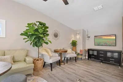 a living room with a couch and a table at Bohemian Retreat in the Heart of Orlando in Orlando
