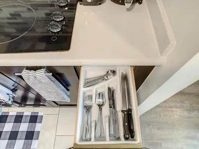 a drawer in a kitchen with silver utensils at Pet Friendly in Orlando area near Disney in Orlando