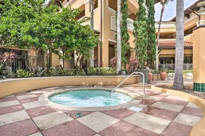 a hot tub in the middle of a courtyard at Disney Good Neighbor Resort Condo Less Than 4 Mi to WDW! in Orlando