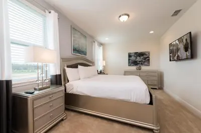 a bedroom with a bed and a window at Alluring Home With Private Pool Near Disney With Waterpark Resort Access At Encore Resort - 7732Ff in Kissimmee