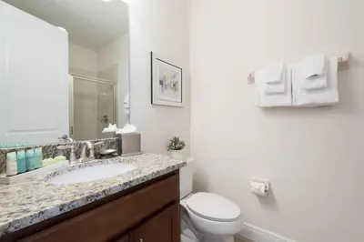 a bathroom with a sink and a toilet at Alluring Home With Private Pool Near Disney With Waterpark Resort Access At Encore Resort - 7732Ff in Kissimmee