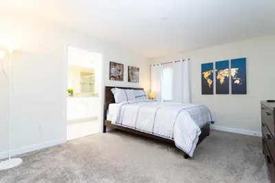 a bedroom with a bed and a window at Magnificent 5Bd w/ Pool Close to Disney @Storey Lake 4800 in Kissimmee