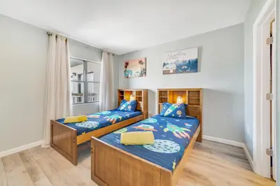 a bedroom with two beds and a window at Fabulous Resort Condo with Heated Pool! in Orlando