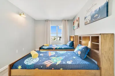 a bedroom with two beds and a window at Fabulous Resort Condo with Heated Pool! in Orlando