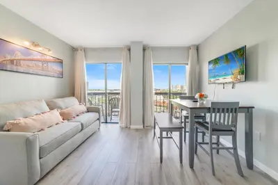 a living room with a couch and a table at Fabulous Resort Condo with Heated Pool! in Orlando