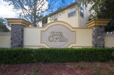 a building with a sign that reads club controller at Club Cortile 3 Bedroom Condo Resort Pool 8 Miles to Disney in Kissimmee