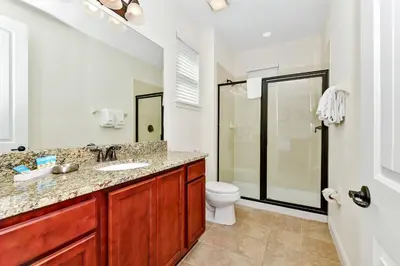 a bathroom with a sink and a toilet at Spectacular Home Near Disney With Private Pool And Waterpark & Resort Access At Encore Resorts Reunion - 7523Mr in Kissimmee