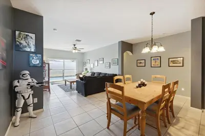a living room with a table and a star wars toy at Vacation Resort Home Right Outside of Disney World Parks with Private Pool home in Kissimmee